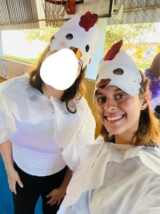 Two teachers in chicken masks